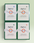 Four identical boxed cards arranged in a 2x2 grid on a pale mint background. The boxes are dark green with white front panels, featuring the brand name PATHS and the product name Virtuoso Moments, plus a central orange circle and blue line graphic.